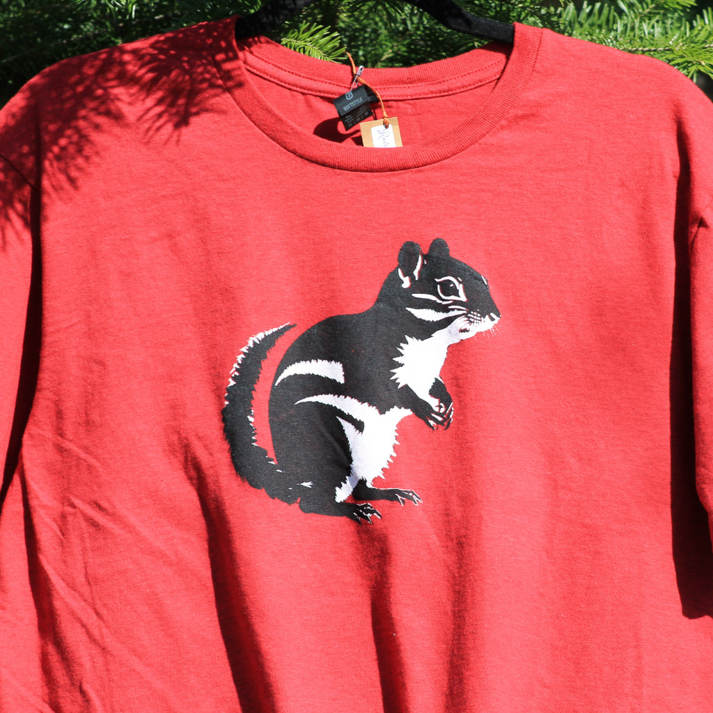 Chipmunk shirt hanging in pines